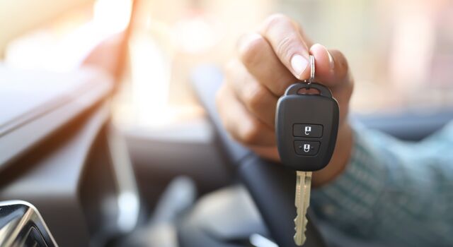 hand holding new car keys