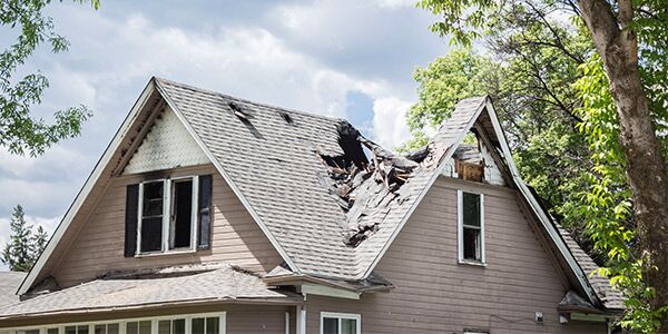 A badly damaged roof that requires a home insurance claim
