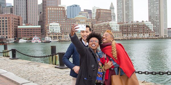 Three people taking a photo in Boston, Massachusetts